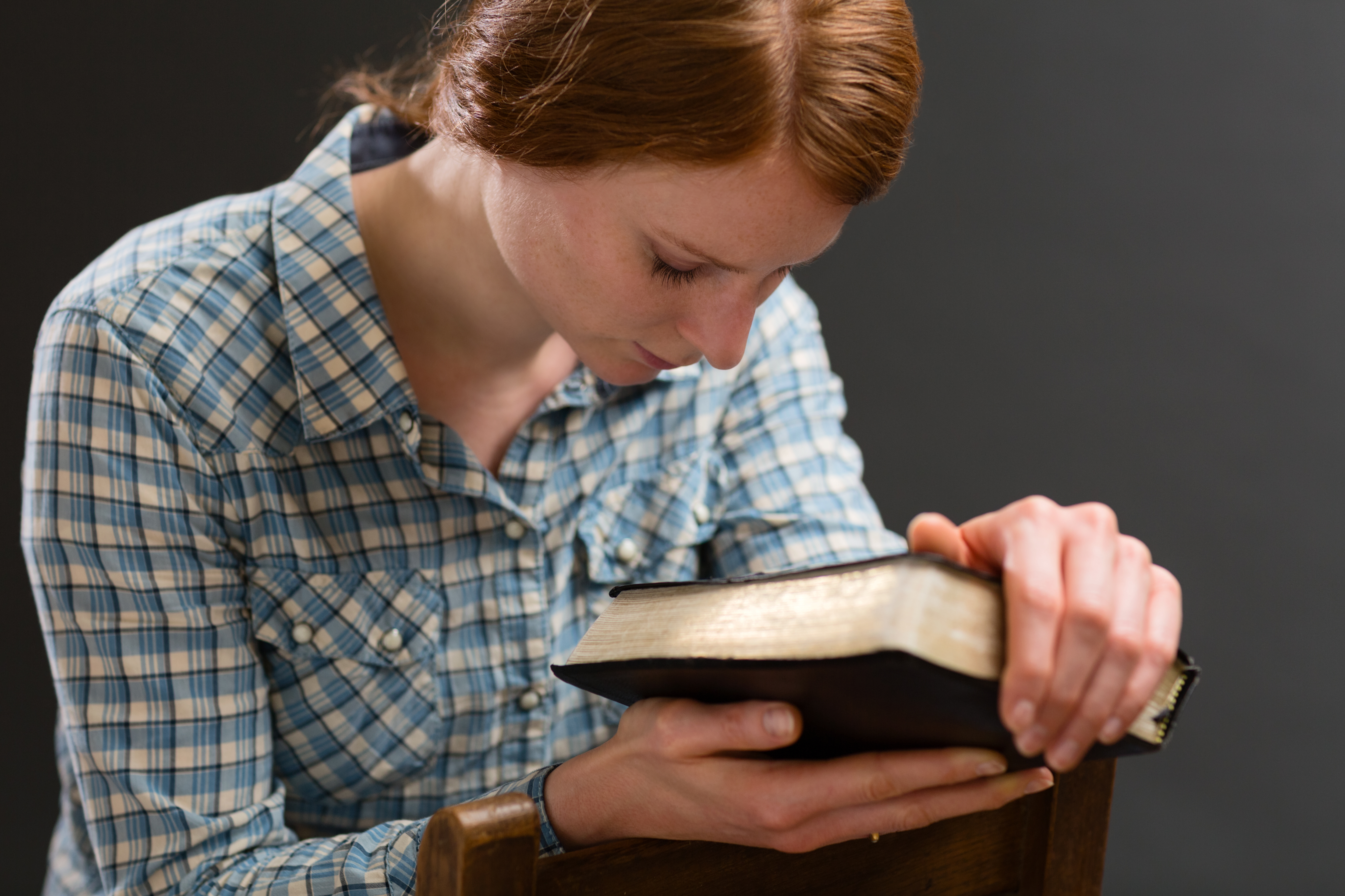 Woman with a Bible Praying