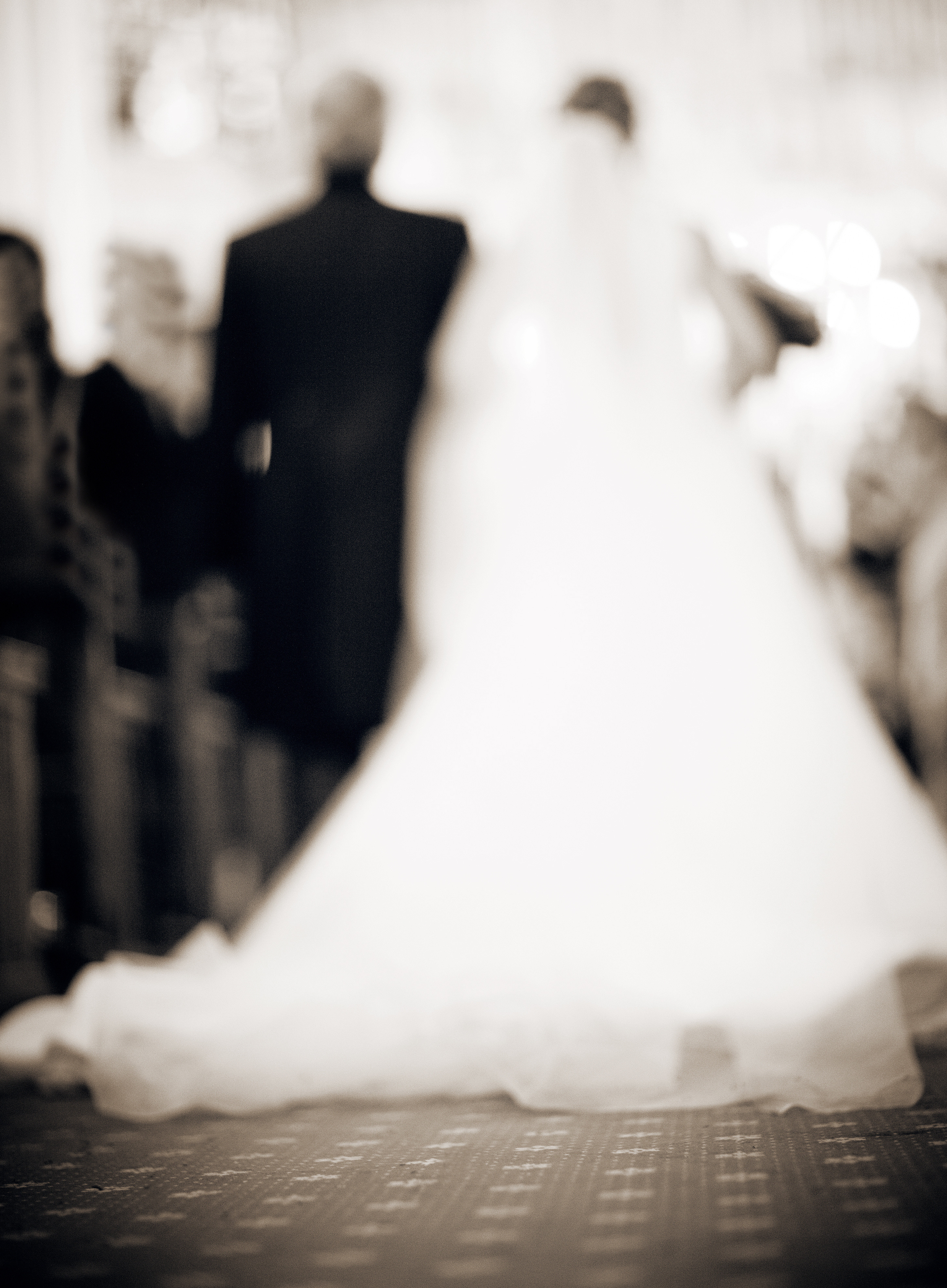 Bride and father in church defocused