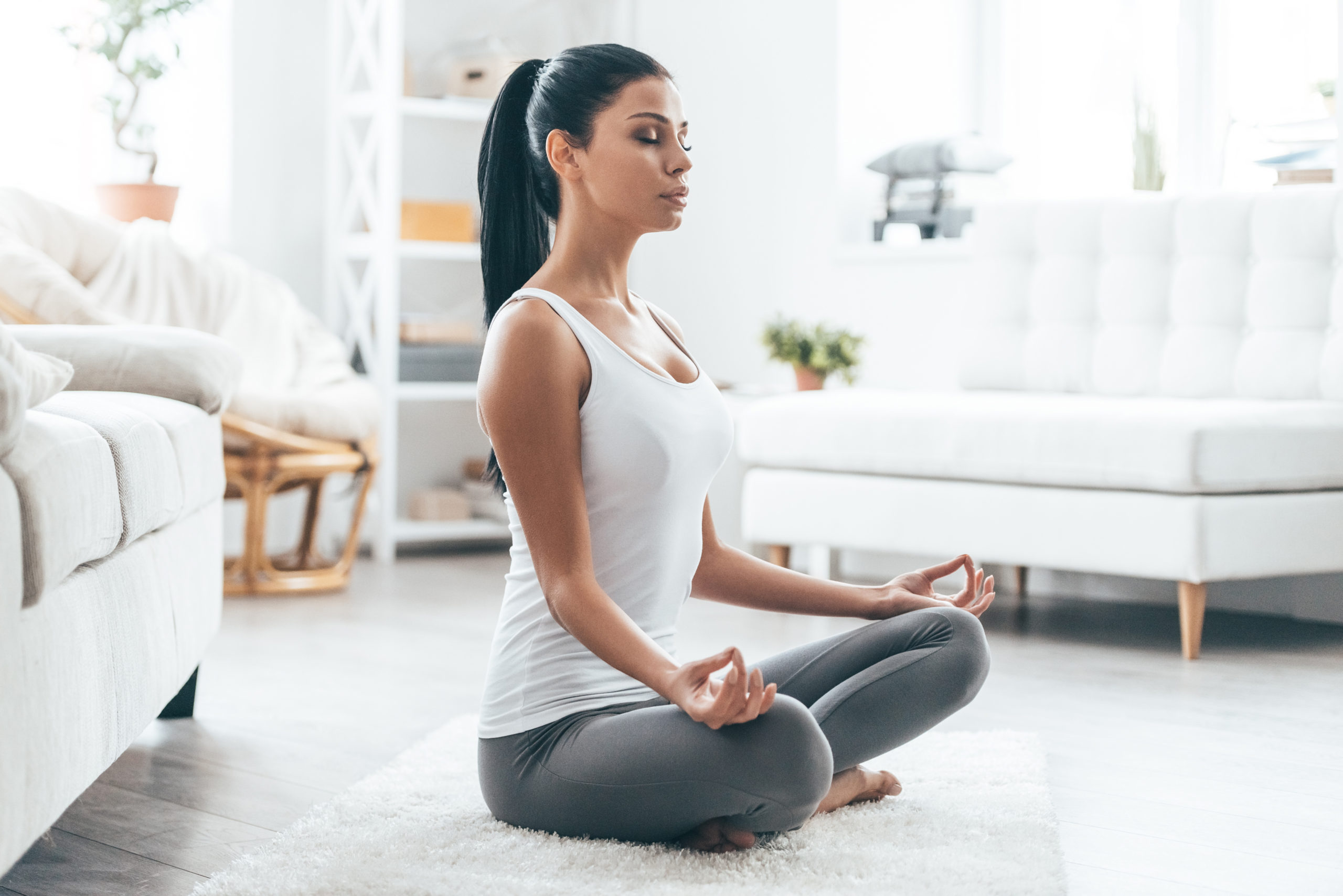 Woman sitting and doing yoga