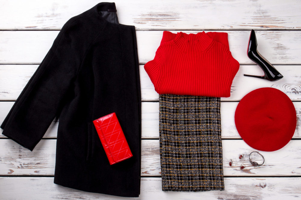 Winter women’s outfit with hat, wallet and accessories.